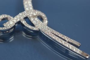 Roundel necklace 925/- Silver rhodium plated with white Baguettezirconia incl. bolt clasp and security eight,